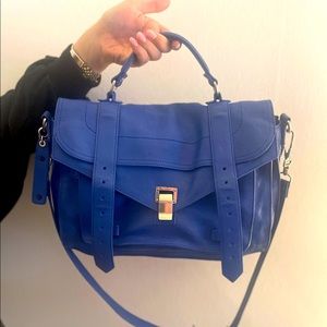 COPY - Proenza cross body and top handle bag.